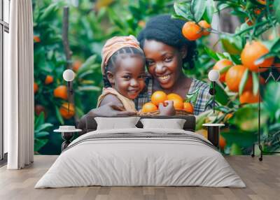 Mother and daughter harvesting oranges together Wall mural