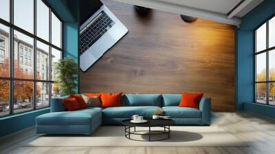 A top-down view of a minimalist home office desk featuring a sleek laptop, a stylish lamp, and two potted plants, creating an inviting workspace environment Wall mural