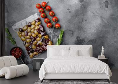 Olives in vacuum pack no label, on gray stone table background, top view flat lay, with copy space for text Wall mural