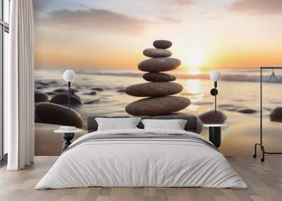 Pyramids of gray zen pebble meditation stones sea or ocean sand beach sunset or sunrise background. Concept of harmony, balance and meditation, spa, massage, relax. Wall mural