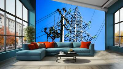 Power line, electric poles with wires, bright blue sky. Wall mural