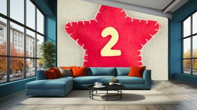 Red star with wooden number 2 on vintage fabric background Wall mural