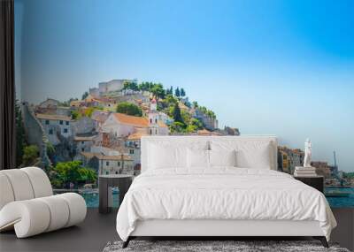 City of Sibenik on the Adriatic coast in Dalmatia, Croatia, fishing and sailing boats in harbor, old town in background Wall mural