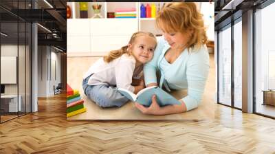 woman reading to her little girl Wall mural