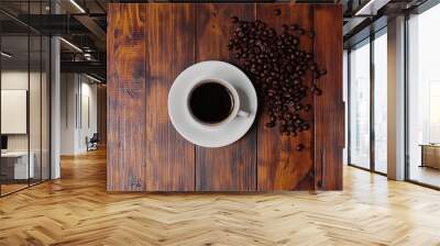 A cup of coffee with fresh beans on a rustic wooden table is a cozy scene for a morning drink. Wall mural