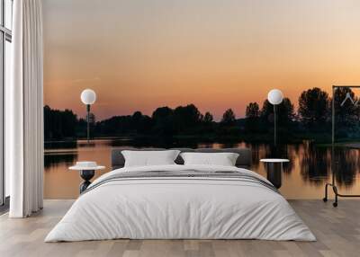 calm water on the river on a beautiful evening at sunset calm and zen Wall mural