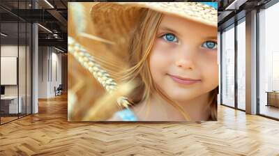 Cheerful young girl with a happy smile in a picturesque wheat field during the beautiful sunset Wall mural