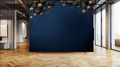 Christmas border of evergreen branches, gold ornaments, stars on blue background, copy space design. Wall mural