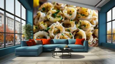 Delicious pan fried calamari rings on rustic wooden board, with lemon, garlic and parsley. Wall mural