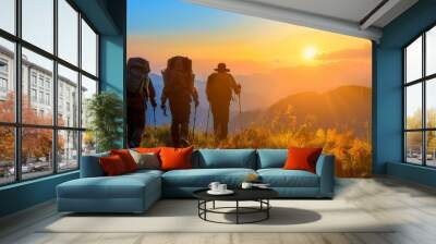 Group hiking in mountains at sunset, exploring nature on summer journey, active hikers together Wall mural