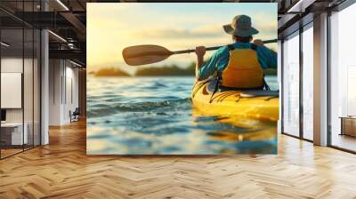 Man paddling kayak at sunset on sea   kayaking and canoeing adventure in serene waters Wall mural