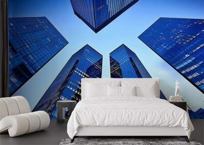 Modern skyline  reflective skyscrapers and business offices against clear blue sky Wall mural