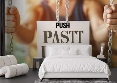 Motivational concept  woman holding  push past limits  sign on abstract blurred success background. Wall mural