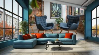 Two Modern Blue Armchairs in a Loft Interior with Industrial Style Decor, Large Windows, and Plants. Wall mural