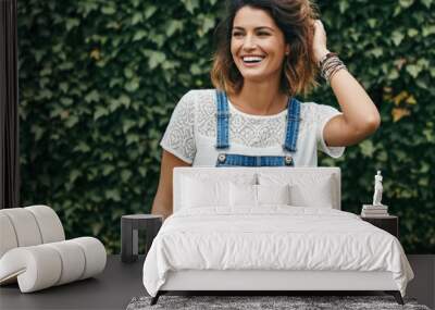 Portrait of a happy smiling young woman. Wall mural