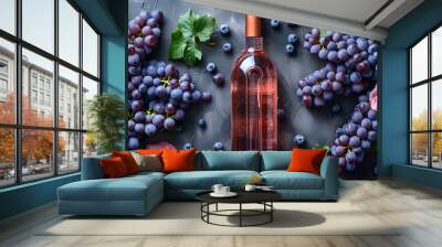 Top view of a bottle of rose wine on a isolated background surrounded by grapes. Good alcohol drink production concept. Blank space for product placement or advertising text. Wall mural