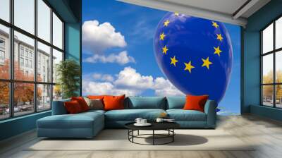 Balloon with the image of the flag of the European Union, flying against the blue sky. Wall mural