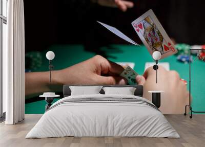 professional poker game. Green poker table with two games. poker player folds by throwing cards on the table Wall mural