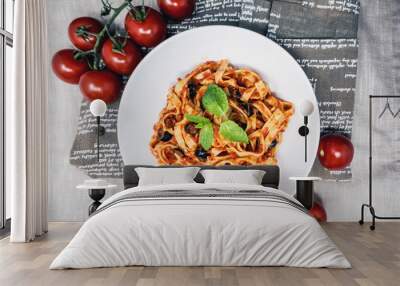 Spaghetti with aubergine and tomato sauce on a the table Wall mural