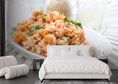 Tasty risotto with Shrimp, fresh herbs vegetables on a white pla Wall mural