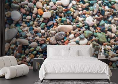 Colorful stones, small pebble beach by the sea, beautiful natural background Wall mural