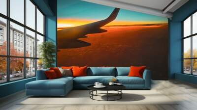 sunset from the wing of the plane Wall mural