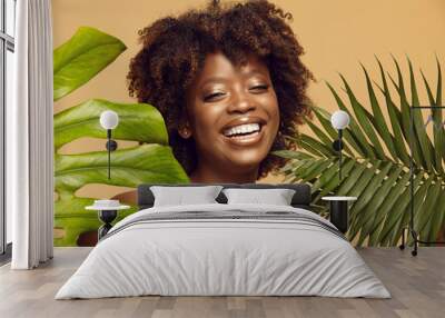 Smiling African American girl with natural make-up. Wall mural