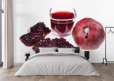 Pomegranate juice in a glass and ripe pomegranate. Isolated on white background Wall mural