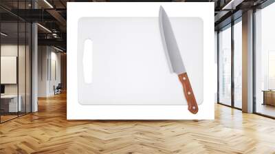 Cutting board and kitchen knife on a white background Wall mural