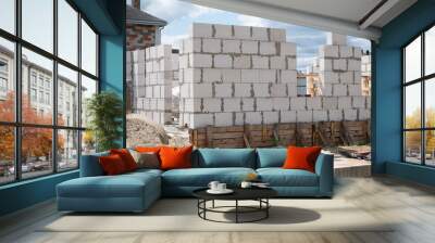 Building walls with aerated concrete blocks on construction site Wall mural