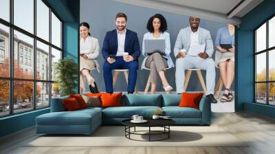 Business people, diversity and networking in row for recruitment, interview or corporate meeting at office. Group of diverse candidates sitting in waiting room working with technology for team hiring Wall mural