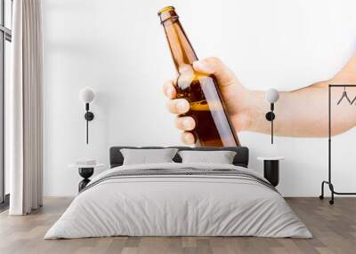 hand holding beer bottle on white background closeup Wall mural