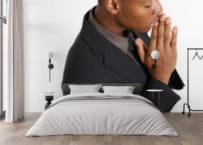 Business man praying on his knees Wall mural