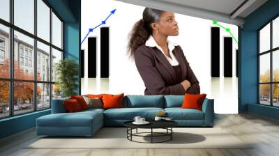 this is an image of a businesswoman in front of two graphs. Wall mural