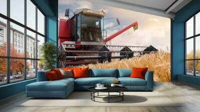 beautiful landscape with a combine harvester in action Wall mural