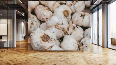 Close-up garlics for sale at a market or supermarket stall. Wall mural