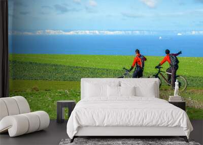 Two mountain bikers facing the English cliffs Wall mural