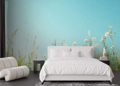 A field of white flowers with a blue sky in the background Wall mural