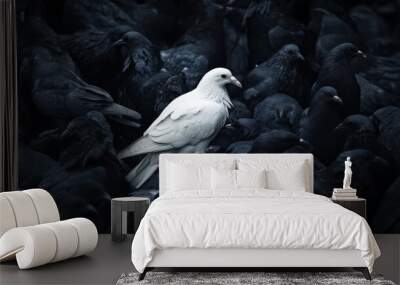 A white bird stands out in a flock of black birds Wall mural