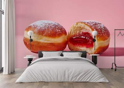 Two donuts with powdered sugar on top and one of them has a hole in it. The donut with the hole is cut in half, revealing a jelly filling. Concept of indulgence and enjoyment Wall mural