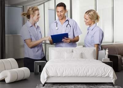 young doctor with two nurses Wall mural