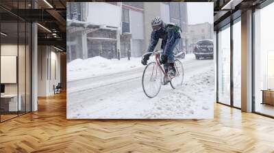 bicycle courier in winter snow storm Wall mural