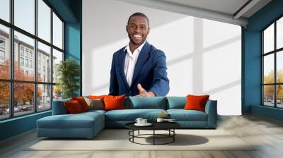 African businessman offer a hand to shake, empty white background Wall mural