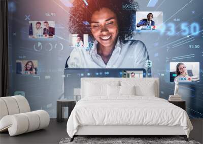 Attractive African American businesswoman using laptop to be a part of video conference call, business colleagues, a team communicating on the distance, hologram digital interface Wall mural