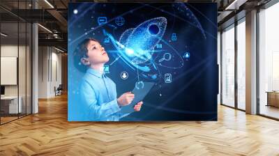 Boy with tablet, startup rocket hologram and business icons Wall mural