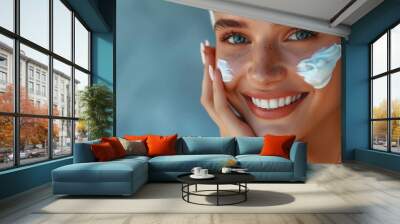 Close-up of a smiling woman applying facial cream, hyperrealistic digital illustration, blue background, skincare and beauty concept. Generative AI Wall mural