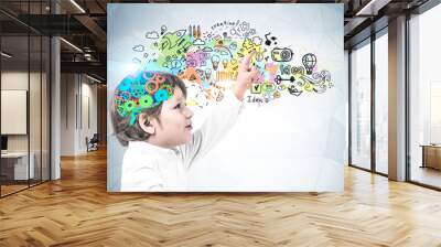 Cute little boy showing creative idea sketch Wall mural