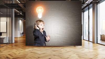 Little kid on the phone and a light bulb sketch on blackboard Wall mural