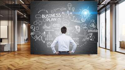 man looking at business plan sketch Wall mural