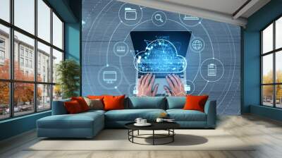 Man typing on laptop, cloud service hologram and devices sync Wall mural